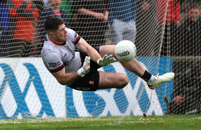 Derry’s goalkeeper Odhran Lynch saves a penalty from Ryan O'Donoghue of Mayo. Photograph: James Crombie/Inpho