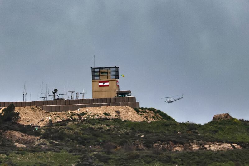 A UN helicopter flies over a Lebanese army outpost in the southern Lebanese village of Al Adisa. Photograph: EPA