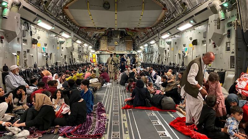 A US military aircraft takes people out of  Afghanistan, at the military airport in Kabul. Photograph:  Shakib Rahmani/AFP via Getty Images