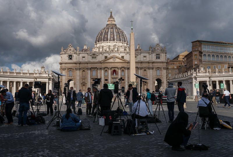 Journalists are getting ready for what could be another long day in St Peter's Square. Photograph: Dimitar Dilkoff/AFP via Getty Images