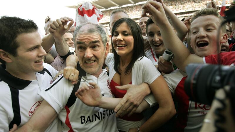 Mickey Harte with his son Matthew (left) and daughter Michaela in Croke Park after All-Ireland success.  Photographer: Dara Mac Dónaill