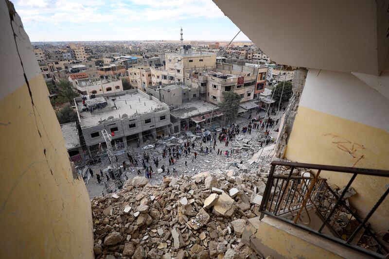 Palestinians inspect the area after an Israeli airstrike in Rafah in Gaza. Photograph: Haitham Imad/EPA