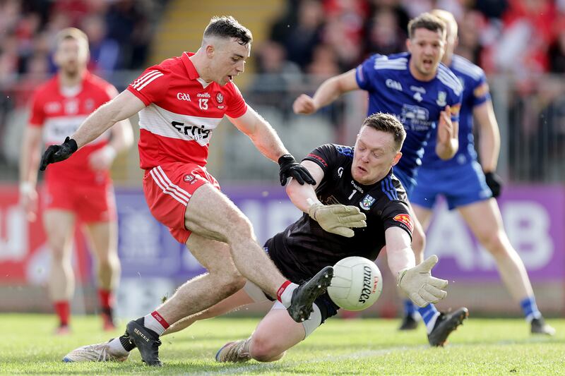 Rory Beggan dives at the feet of Derry's Niall Toner in April. Photograph: Laszlo Geczo/Inpho