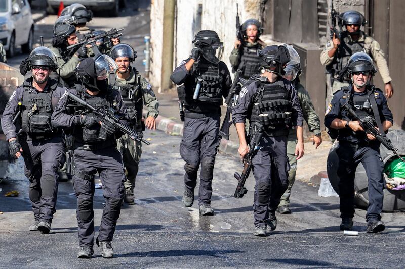 Israeli riot policemen walk during clashes with Palestinian protesters in the Wadi Joz neighbourhood in Israeli-annexed east Jerusalem on Friday. Photograph: Ahmad Gharabli/AFP