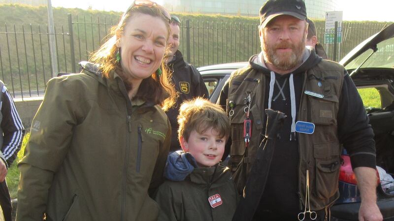 Tolka River opening day: Josie Mahon (IFI) and Sam Duffy (8) with his father, Anthony Duffy