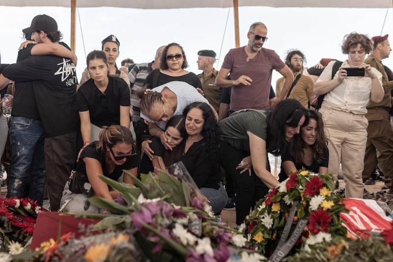 Mourners at the funeral of a family murdered by Hamas in their home during the October 7th attack. Photograph: Avishag Shaar-Yashuv/The New York Times