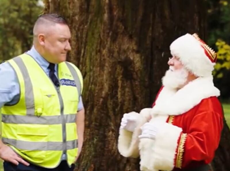 Santa Claus (right) with park ranger Terry Moore in the OPW video