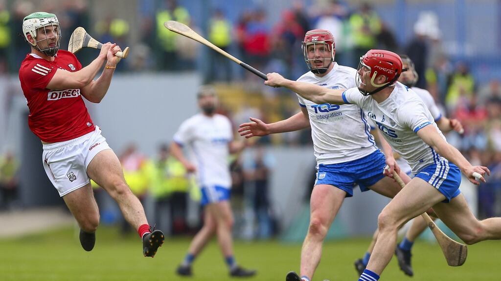 Cork’s Shane Kingston shoots under pressure from Waterford’s Tadhg De Burca in the Munster SHC round 3 game at Walsh Park on Sunday. Photograph: Ken Sutton/Inpho