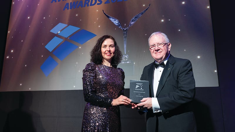 Viktoriia Ivannikova, awards judging coordinator, presents the general and sport aviation award to Harry McNamara, Limerick Flying Club