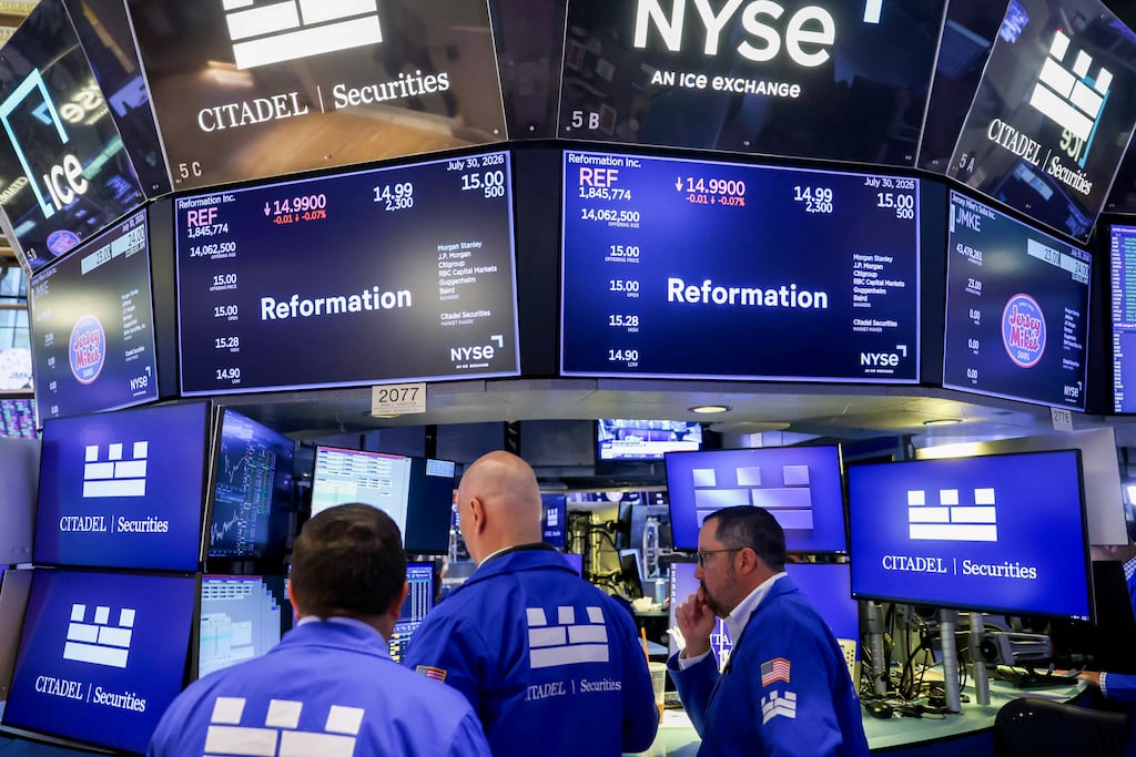 Traders work on the floor of the New York Stock Exchange. US stocks gained in mid-session on Thursday. Photographer: Michael Nagle/Bloomberg