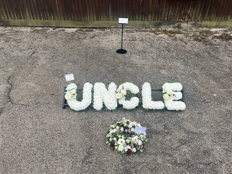 Flowers left for Martin Fallon outside his funeral in Islington Crematorium
