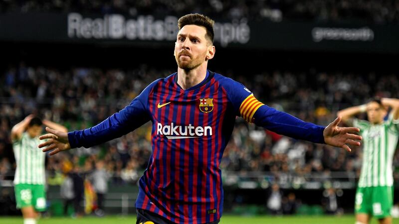 Lionel Messi celebrates after completing his hat-trick against  Real Betis on Sunday. Photograph: Raul Caro/EPA