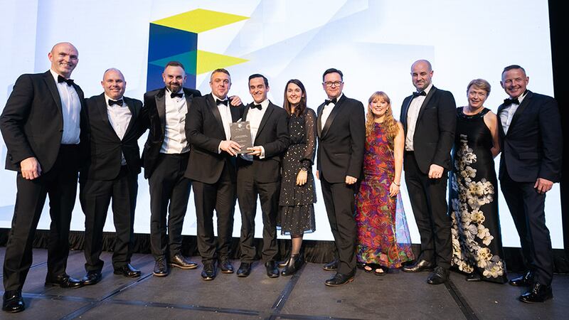Hugh Ward, director of interiors, Ardmac, presents the Fit Out Professional Consultancy of the Year award to Ethos Engineering team.