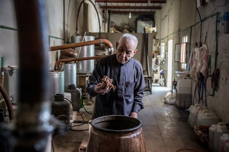 Amin Hamza al Bettar in the distillery inside his home in Qaldoun Al Marah, Syria. Photograph: Sally Hayden