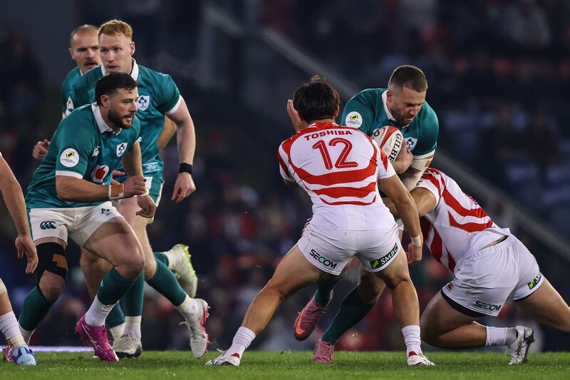 Ireland's Stuart McCloskey is tackled by Japan's Yuya Hirose. Photograph: Ben Brady/Inpho