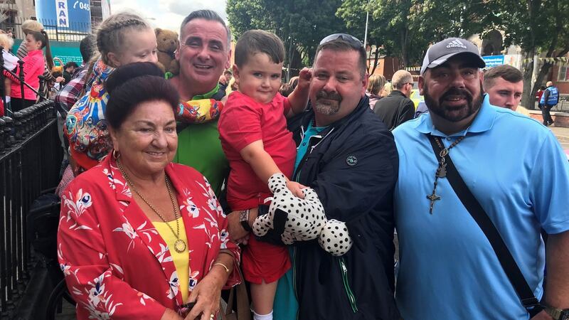 Pat Collins, with her sons Lawrence, Noel and Brendan and grandchildren Tilly and Joseph, as they await the arrival of Pope Francis on Sean McDermott Street in Dublin.  Photograph: Rebecca Black/PA