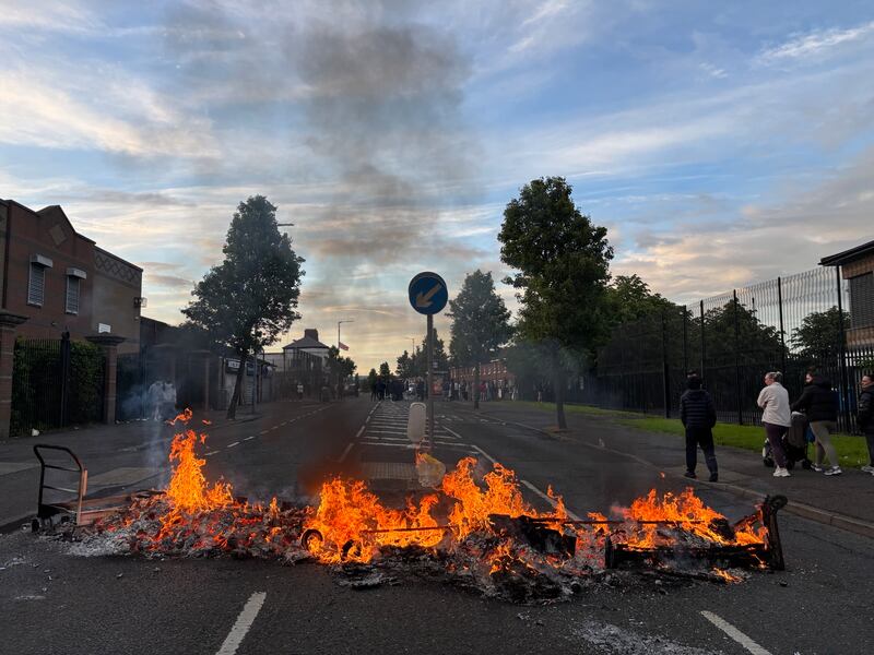 Protesters burn out a barricade in the Tigers Bay Area of Belfast. Picture: Enda O’Dowd