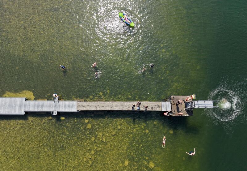 Swimmers cooling down at the Lough Owel diving board. Photo: Alan Betson/The Irish Times

