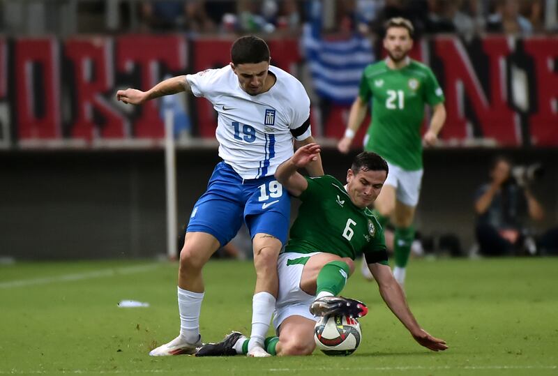 Josh Cullen of Republic of Ireland battles for possession with Christos Zafeiris of Greece. Photograph: Milos Bicanski/Getty Images