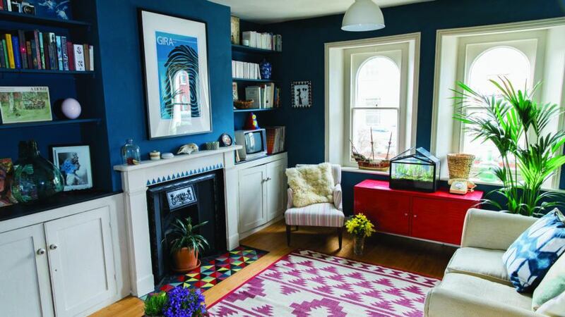 A painted fireplace gets a blue stencil frieze of triangles that picks out the another shade of the colour used on the walls in the room. The top of a side table gets the sgraffito treatment, a technique that was popularised during the Renaissance. Photographs: Fresh Style Hoffman and Stephen Devries