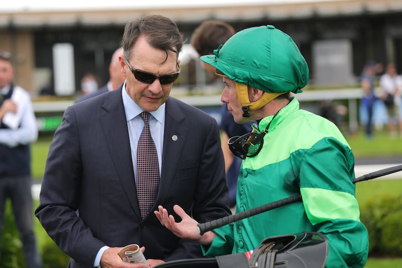 Ryan Moore (right), pictured speaking with trainer Aidan O'Brien, will ride Emit for Joseph O'Brien in the Ebor Handicap. Photograph: Bryan Keane/Inpho