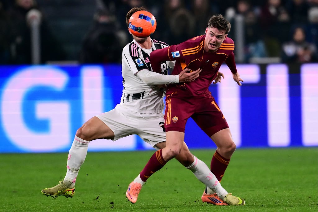 Roma's Evan Ferguson grapples with Juventus' Daniele Rugani during the Serie A clash between the teams on Saturday evening. Photograph: Marco Bertorello / AFP via Getty Images