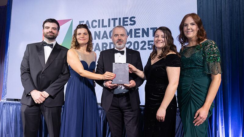 Daniel Keane, strategic partnership manager at Synergy Security Solutions, presents the property management company of the year award to the Wyse Property Management team