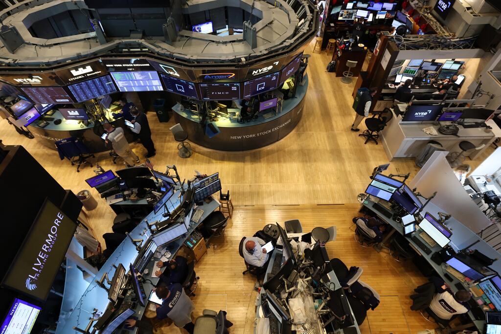 Traders work on the floor of the New York Stock Exchange. Photograph: Getty