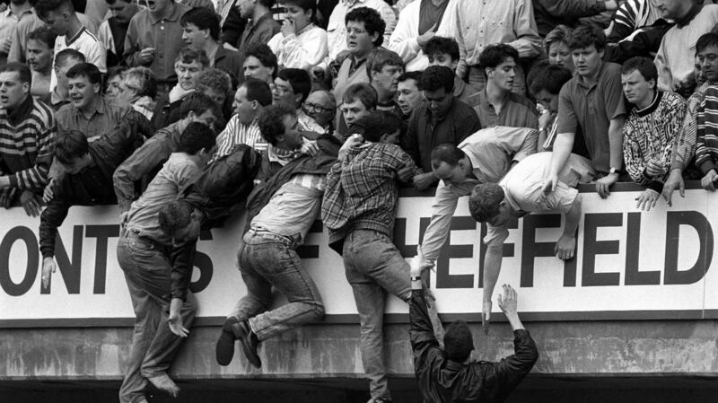 Liverpool fans trying to escape severe overcrowding during the FA Cup semi-final match between Liverpool and Nottingham Forest at Hillsborough on April 15th, 1989. Photograph:  David Giles/PA Wire