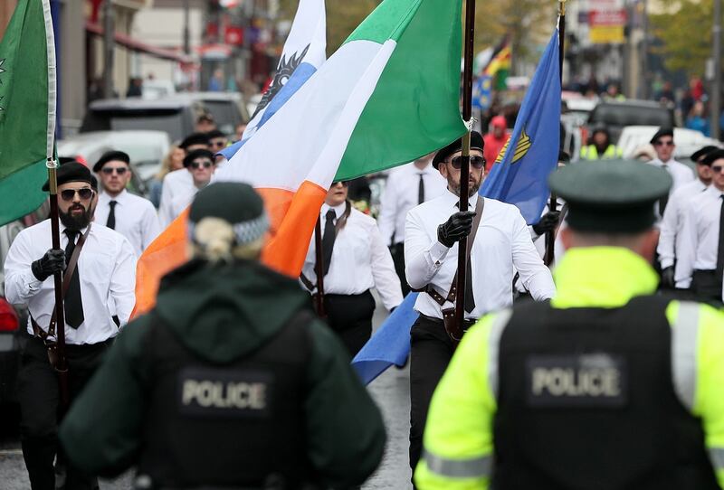 PSNI officers look on at the parade on Sunday. Photograph: Brian Lawless/PA Wire