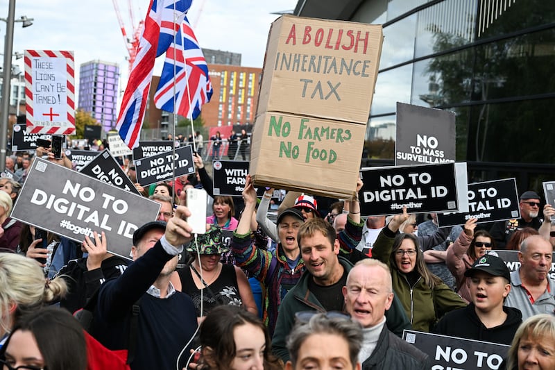 Protesters hold placards with slogans that read "no to digital ID" on the opening day of the Labour Party annual conference in Liverpool. Photograph: Chris J. Ratcliffe/Bloomberg