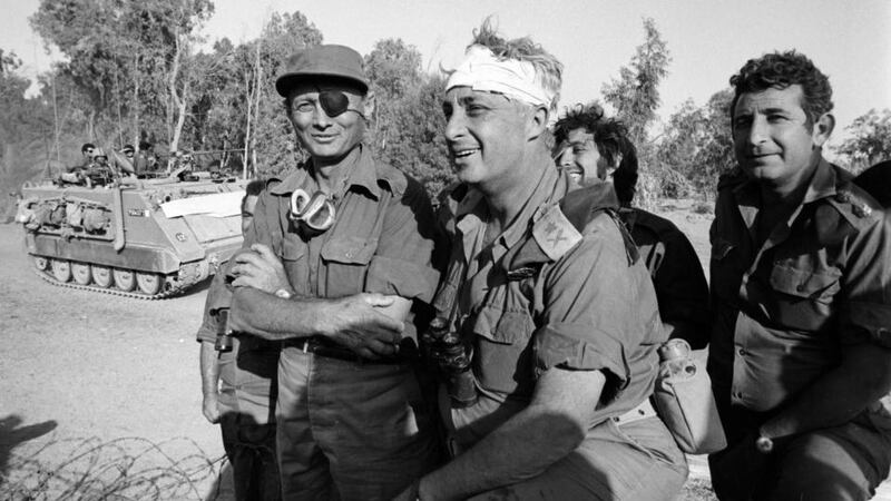 A young Gen Ariel Sharon (centre) with Israel’s then defence minister Moshe Dayan (left) and other, unidentified army officers during Israel’s Six Day War in June 1967. Photograph: EPA/Israeli ministry of defense