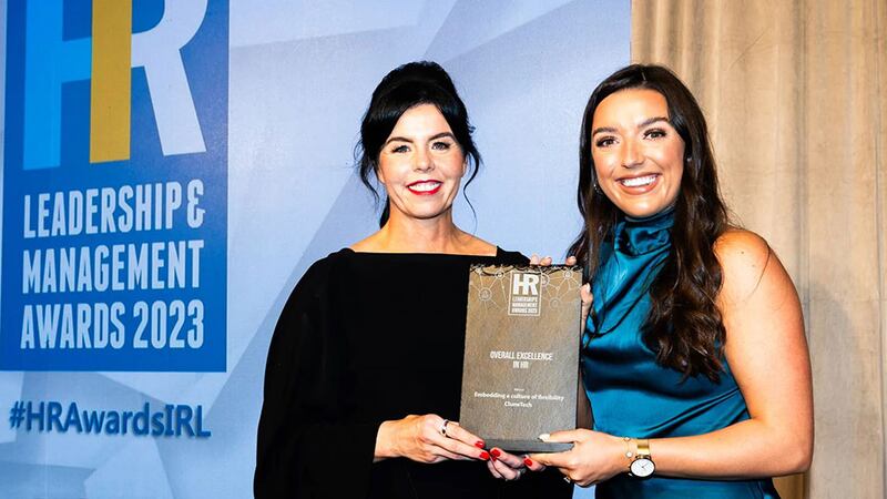 Maureen Walsh, managing director, DeCare, presents the overall excellence in HR award to Rachael Quinlan, CluneTech