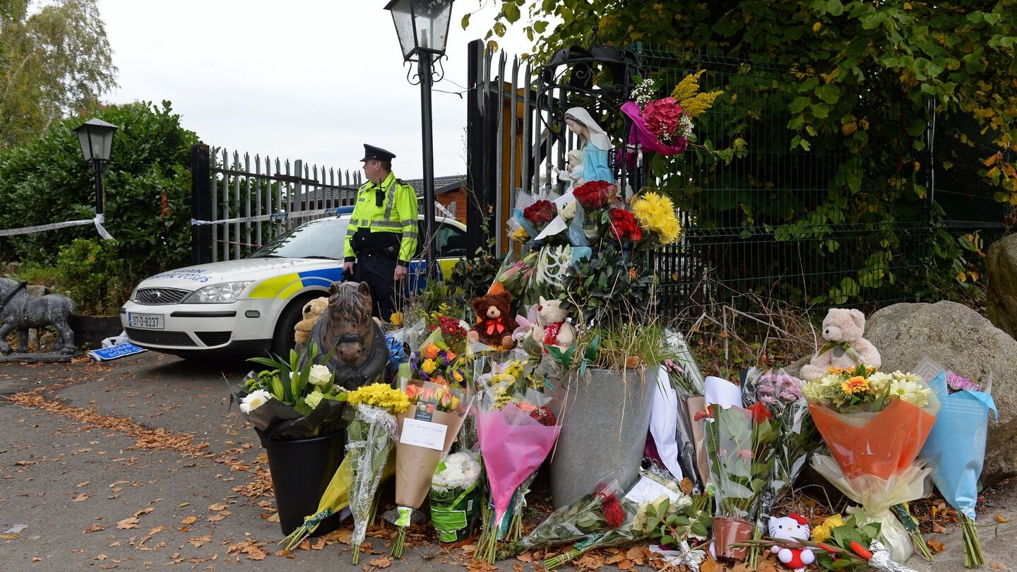 Flowers left  on Sunday at the scene of the fire at a halting site on Glenamuck road in  Carrickmines, Co. Dublin. Photograph: Eric Luke/The Irish Times