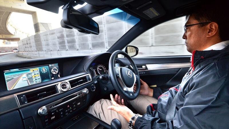 Look, ma,  no hands: A self-driving Toyota Lexus on busy Tokyo streets – it’s unnerving at first. Photograph: Yoshikazu Tsuno/AFP