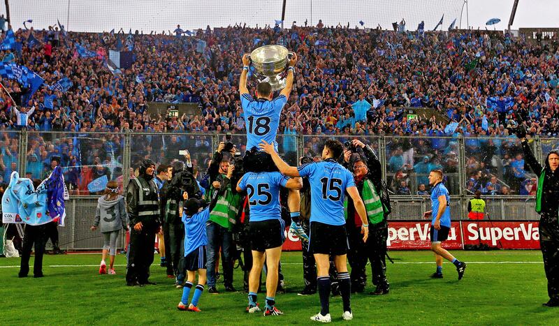 Alan Brogan lifts the Sam Maguire Cup in front of supporters on Hill 16 following Dublin's All-Ireland SFC final victory against Kerry in 2015. Photograph: Donall Farmer/Inpho