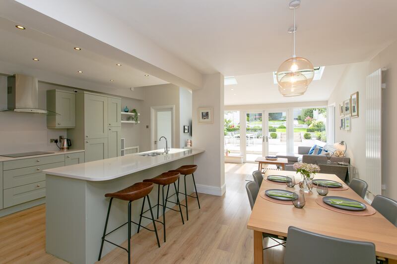 Kitchen, breakfast bar and dining area leading through to rear extension. Photograph: Brian Dempsey