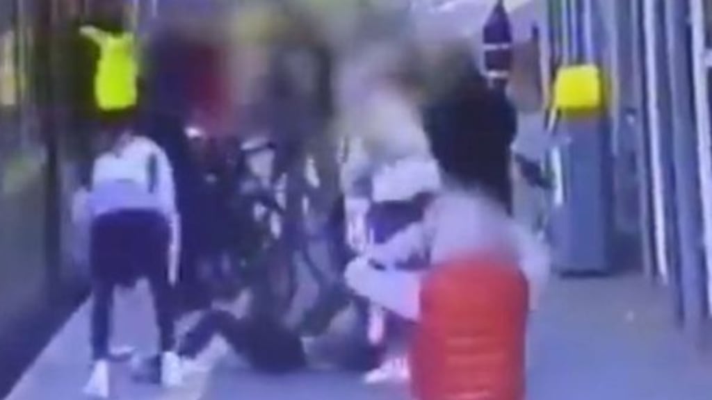 CCTV footage of the incident shows a youth pushing the wheel of his bicycle towards a young woman, causing her to fall on to the tracks into the gap between the train and platform