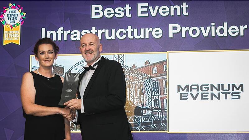 Mark French, Director, Mobile Escape Rooms presents the Best Event Infrastructure Provider award to Elaine O'Connor, Magnum Events.
