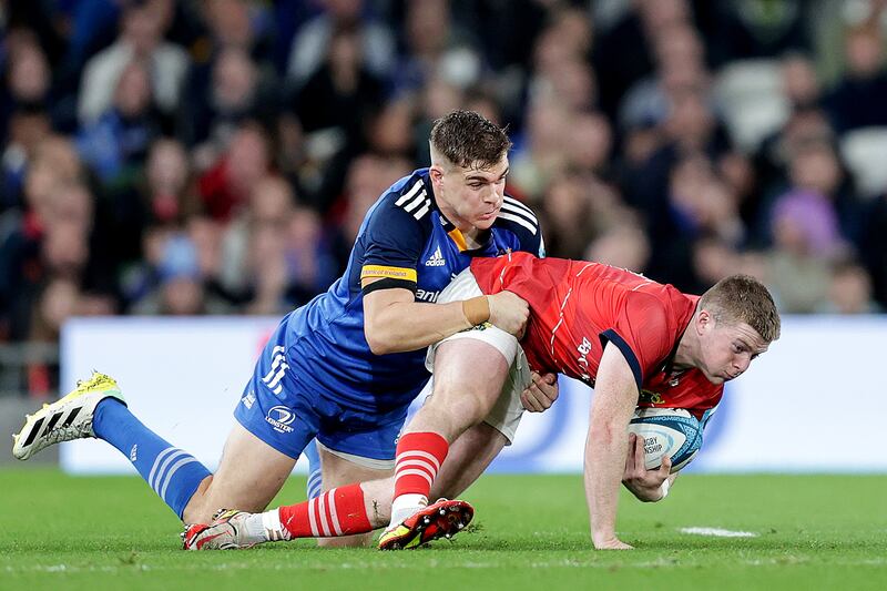 Munster's Patrick Campbell is tackled by Garry Ringrose of Leinster during the BKT United Rugby Championship at the Aviva stadium, Dublin. Photograph: Laszlo Geczo/Inpho