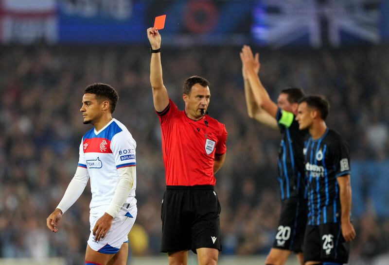 Max Aarons of Rangers is shown a red card by referee against Club Brugge. Photograph: Alex Bierens de Haan/Getty
