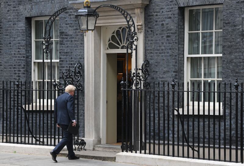 Britain's prime minister Boris Johnson leaves after making a resignation statement in front of 10 Downing Street in central London. Photograph: Daniel Leal/AFP/Getty 