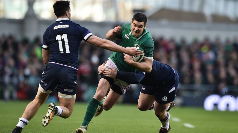 Johnny Sexton of Ireland is tackled by Sean Maitland and WP Nel of Scotland during the Six Nations  match at the Aviva Stadium.  Photograph: Charles McQuillan/Getty Images