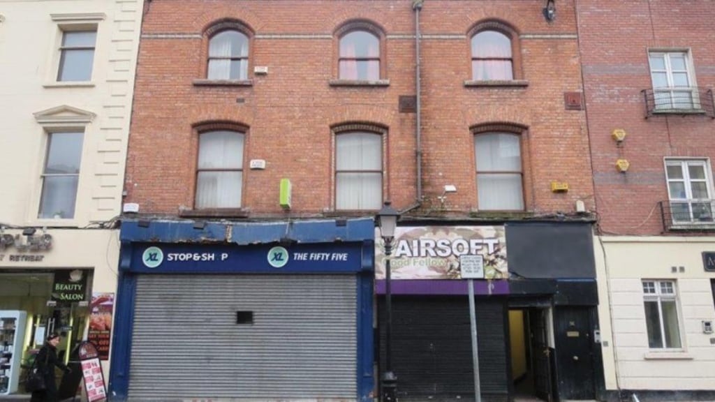 The property has a retail unit and two apartments