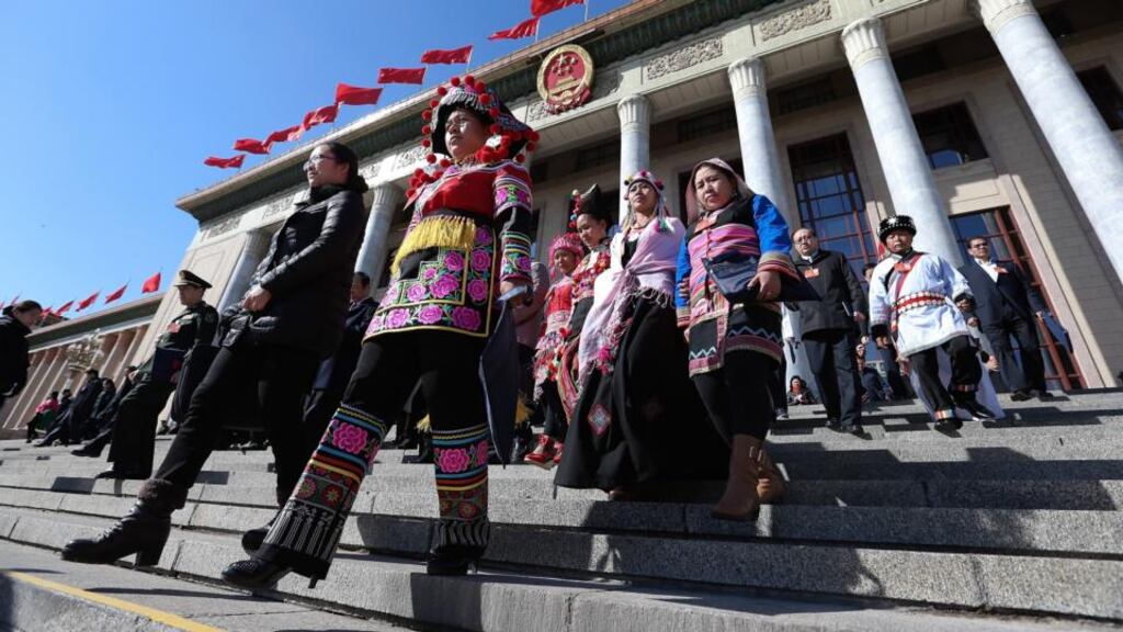 Delegates representing ethnic minorities leave the Great Hall of the People after attending the sessions of National People’s Congress in Beijing yesterday. Photograph: Lintao Zhang/Getty Images