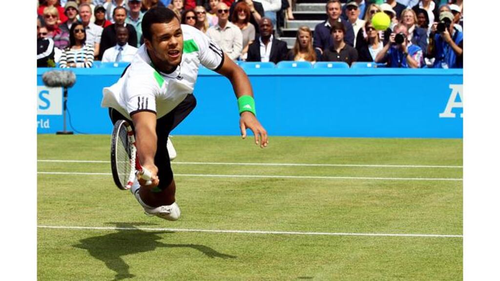 Jo-Wilfred Tsonga of France dives to return to Andy Murray during the men's singles final on day eight of the AEGON Championships at Queens Club, London, England. - (Photograph: Clive Brunskill/Getty Images)