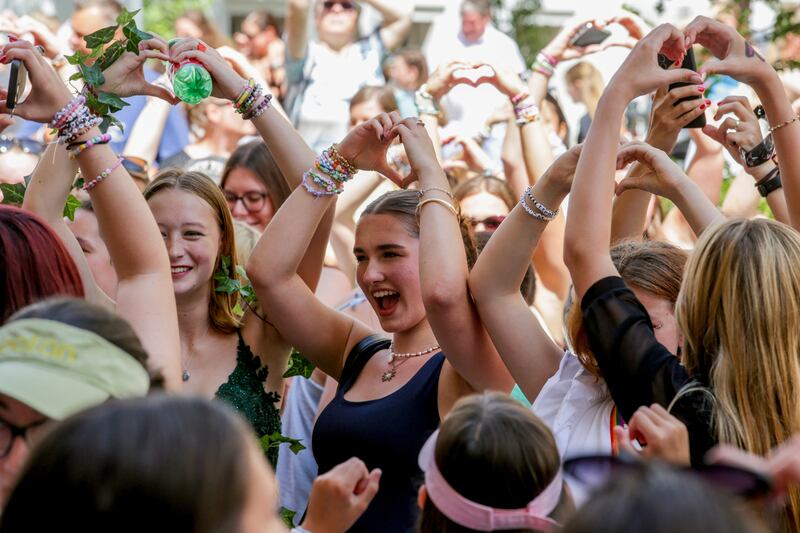Fans of Taylor Swift sing and dance in Vienna. Photograph: Heinz-Peter Bader/AP