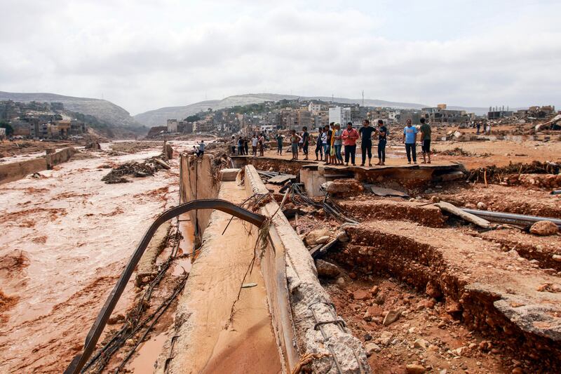 People look at the damage caused by floods in Derna. Photograph: AFP via Getty