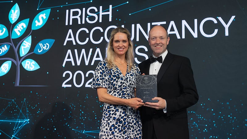 Joanne Hillery, head of Ireland sales at Circit, presents the large practice of the year award to Neil Hughes, Azets Ireland