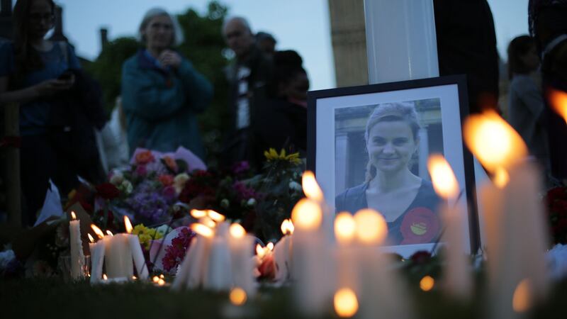 Candles are lit around floral tributes in Parliament Square central London on June 17, 2016 in remembrance of Labour MP Jo Cox who was killed on a street in Birstall on June 16th.  Photograph: Daniel Leal